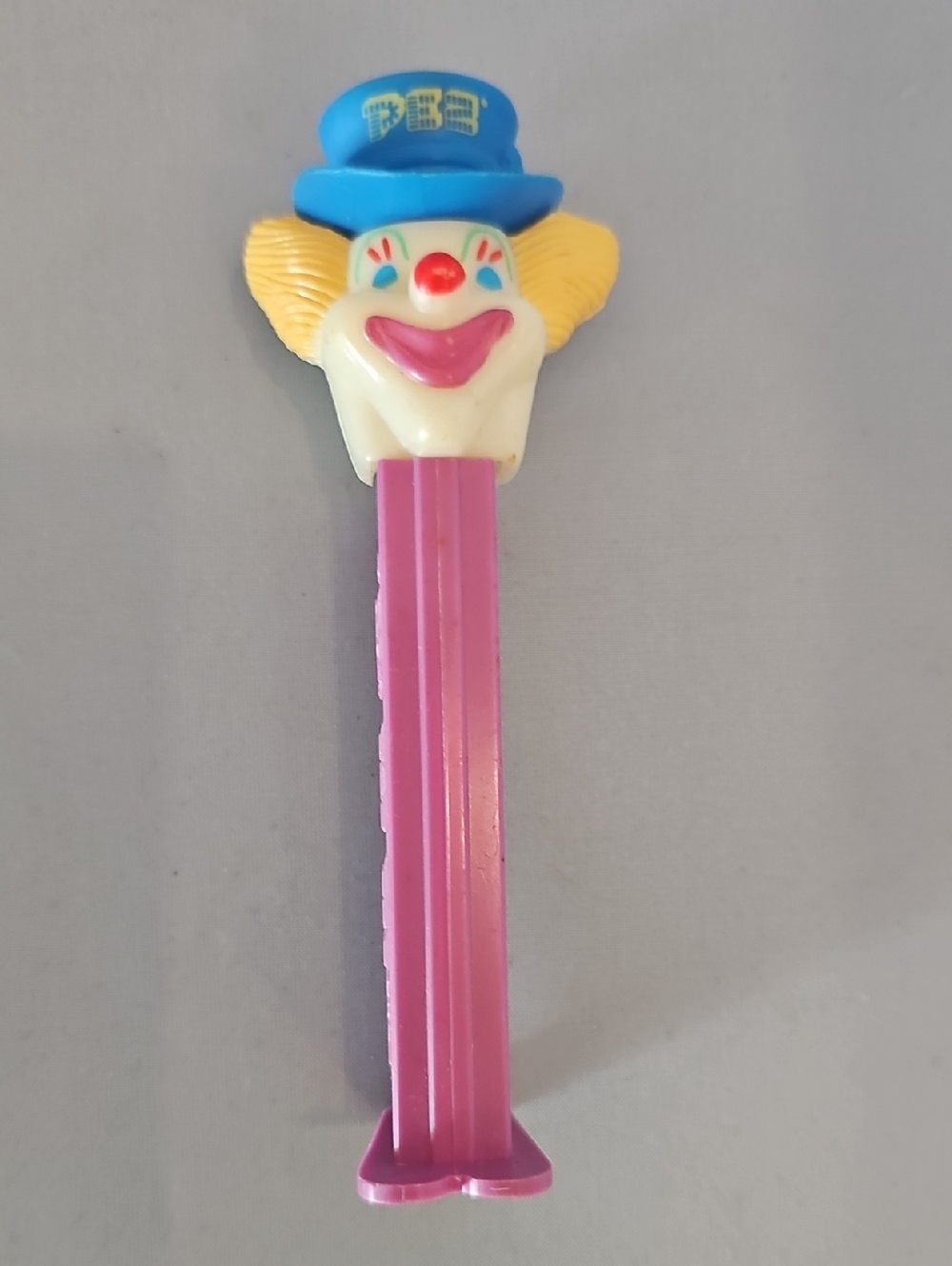 Clown PEZ Dispenser with Pink Stem and Blue Hat